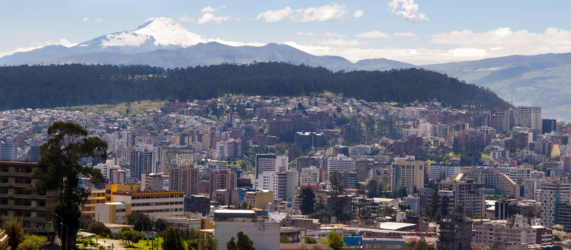 Photograph showing the city of Quito, Ecuador in front of the Pichincha skyline.